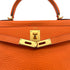 HERMES KELLY 28 RETOURNE ORANGE TAURILLON CLEMENCE HAND SHOULDER BAG □G GOLD HARDWARE 90309670