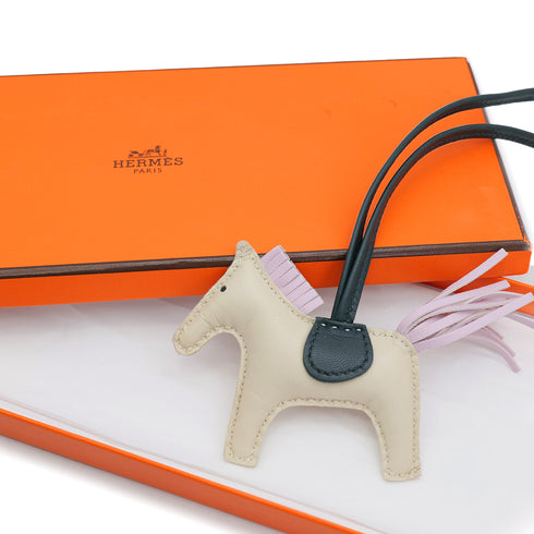HERMES BAG CHARM RODEO PM CRAIE ROSE SAKURA VERT CYPRESS AGNEAU MILO U 90309833 - PURPOSE