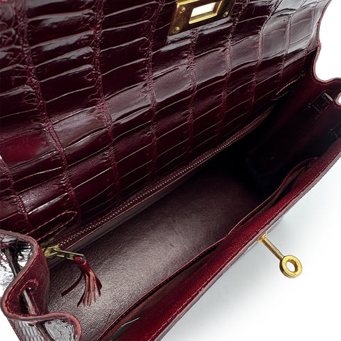 HERMES KELLY 28 SELLIER BORDEAUX CROCODILE HAND BAG 2004 CIRCLE H GOLD HARDWARE 90310278 - PURPOSE
