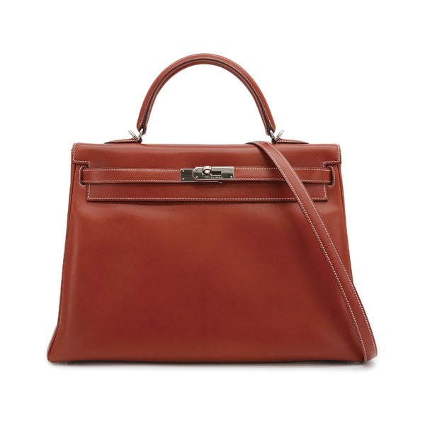HERMES KELLY 35 RETOURNE BRICK BOXCALF HAND SHOULDER BAG 2010 SQUARE N PALLADIUM HARDWARE 90310335 - PURPOSE